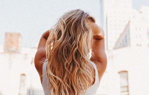 Beautiful blonde woman with long, wavy hair